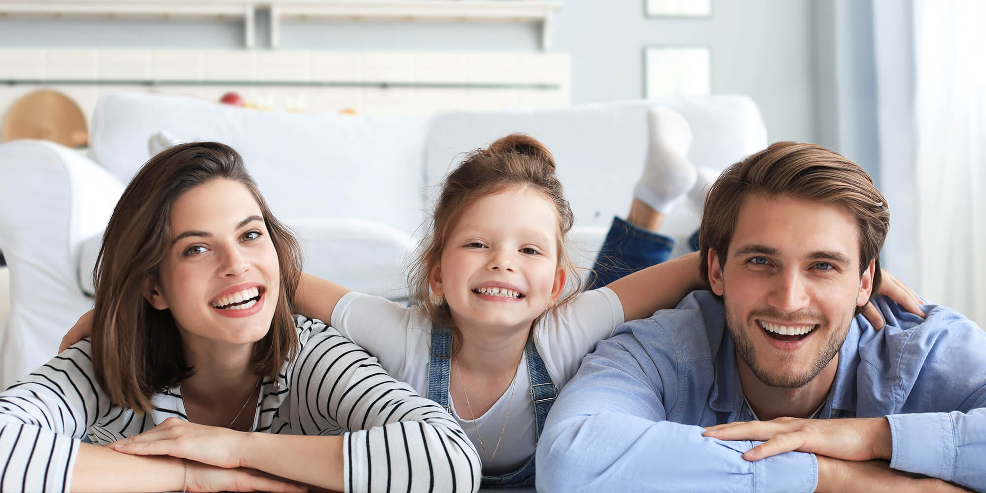 stock photo-young-caucasian-family-with-small-daughter-pose-relax-on-floor-in-living-room-smiling-little-girl-1936919602