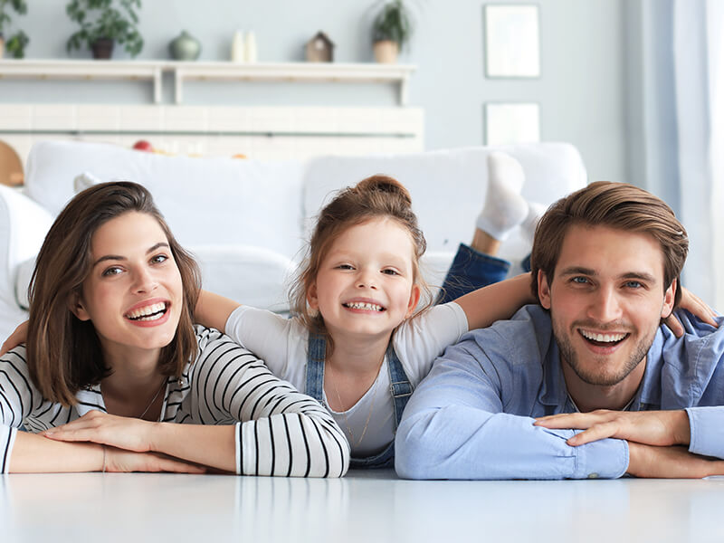stock photo-young-caucasian-family-with-small-daughter-pose-relax-on-floor-in-living-room-smiling-little-girl-1936919602