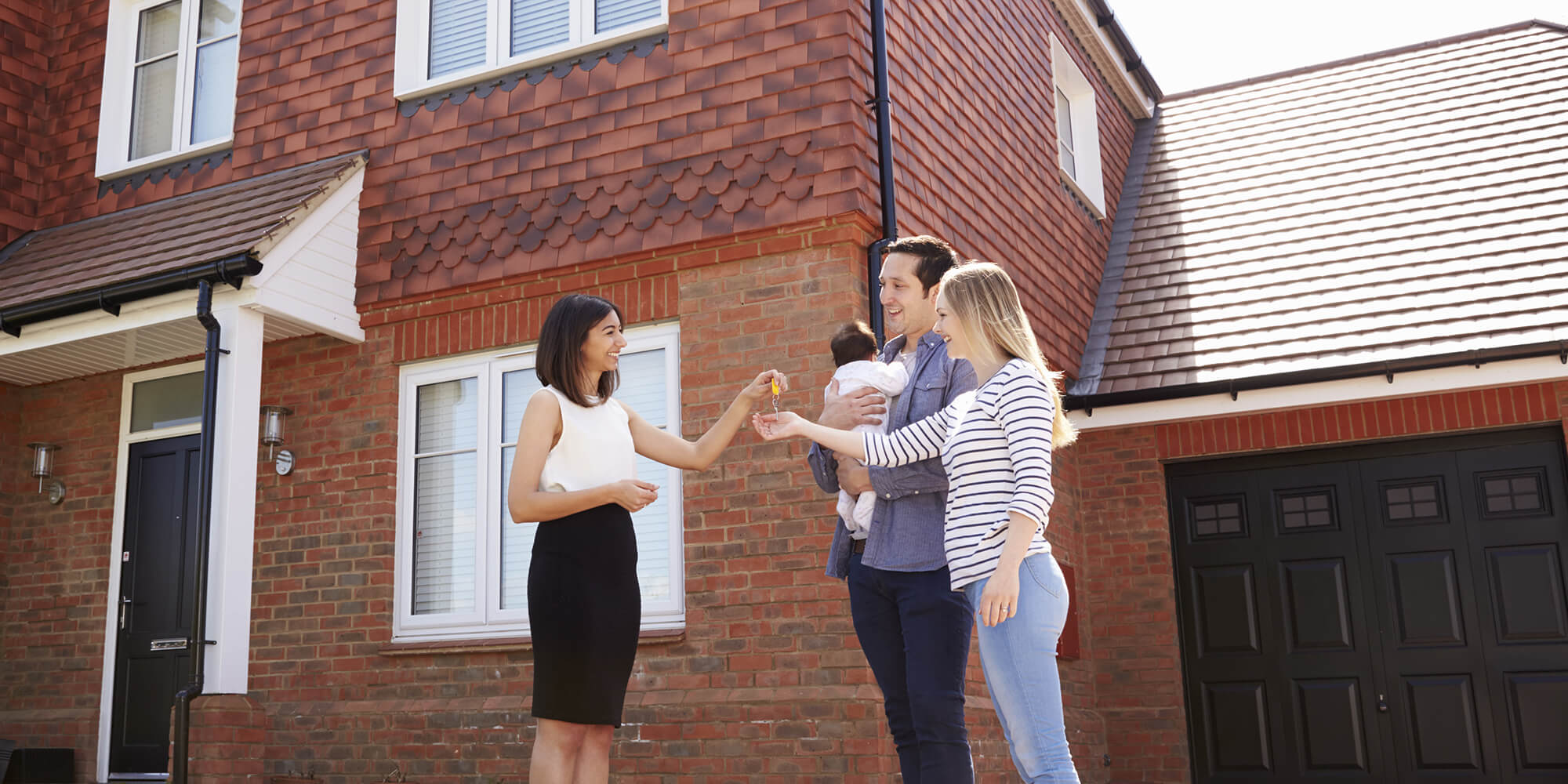 stock photo-a-happy-young-married-couple-moves-to-new-apartment-1187491945