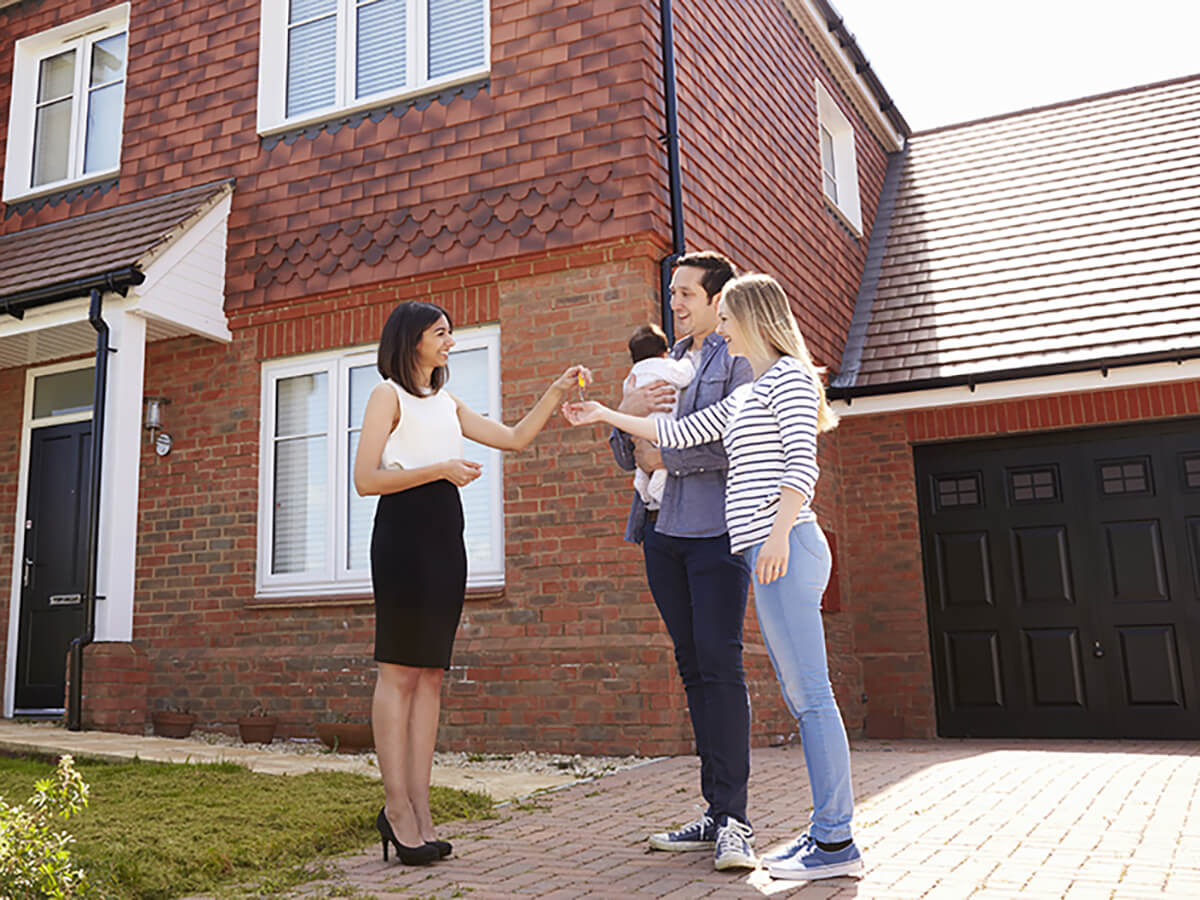 stock photo-a-happy-young-married-couple-moves-to-new-apartment-1187491945